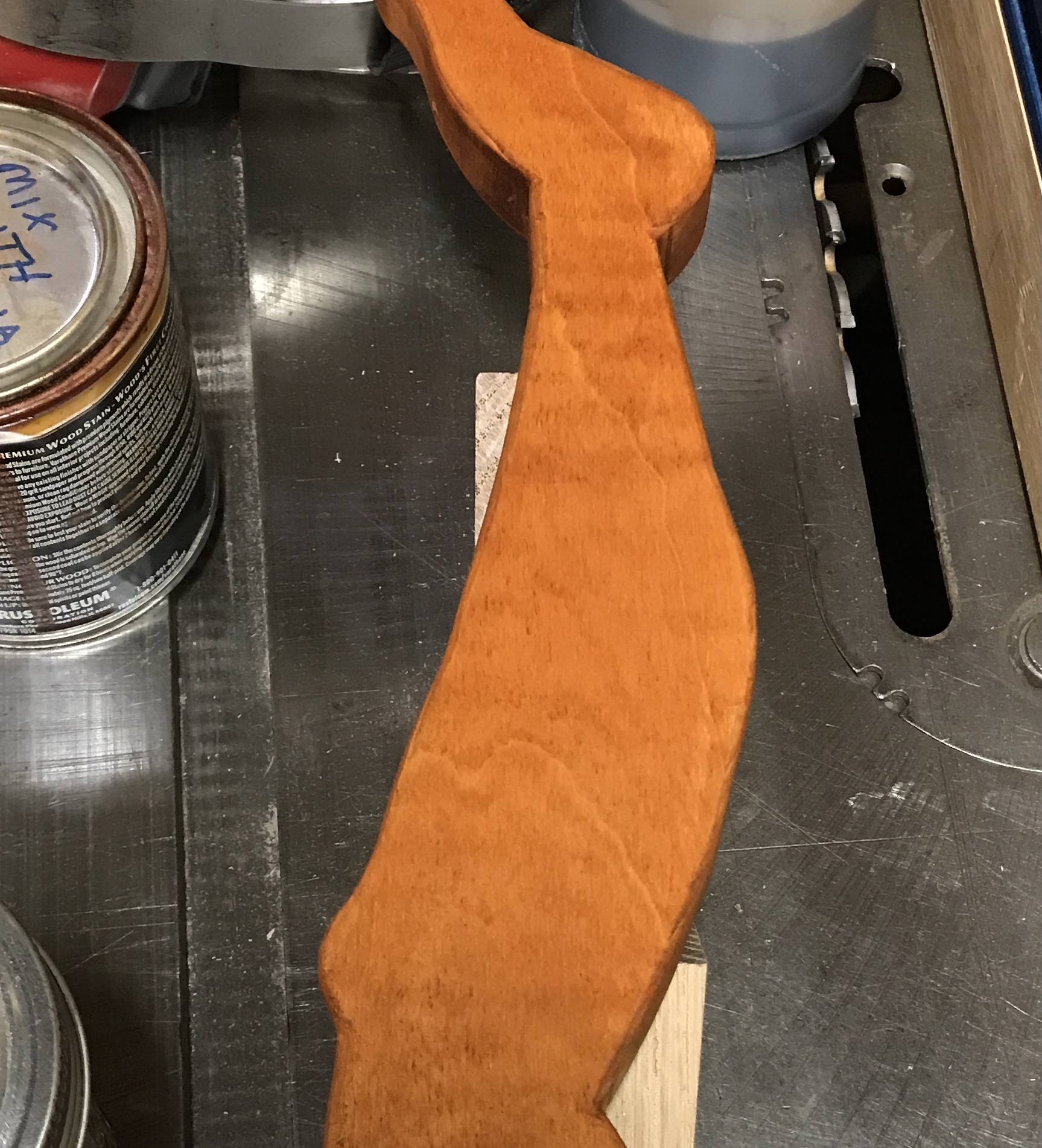 One maple leg stained orange